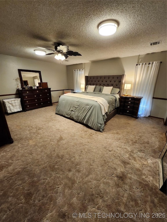 2230 Robin Ln, Muskogee, OK 74403 - carpeted bedroom with ceiling fan and a textured ceiling