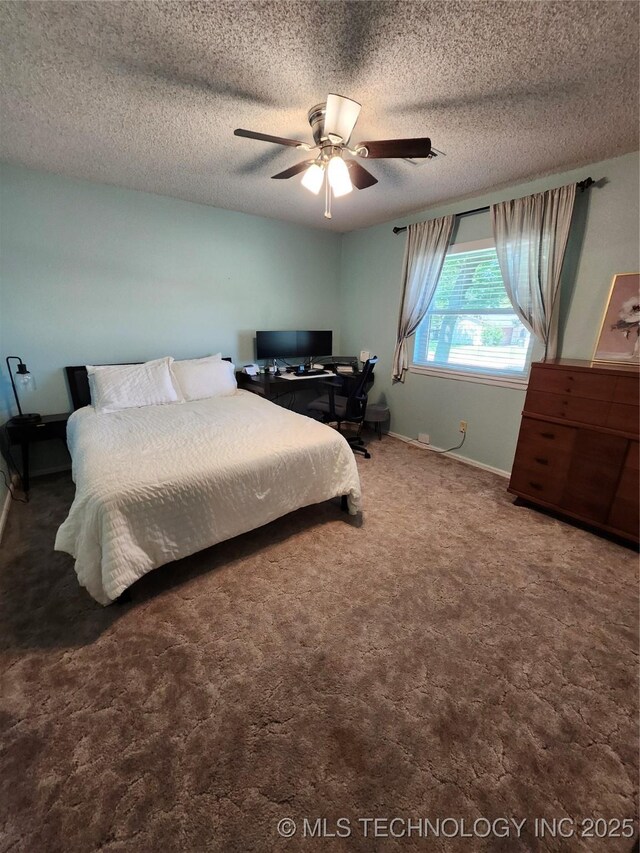 2230 Robin Ln, Muskogee, OK 74403 - bedroom with carpet flooring, baseboards, ceiling fan, and a textured ceiling