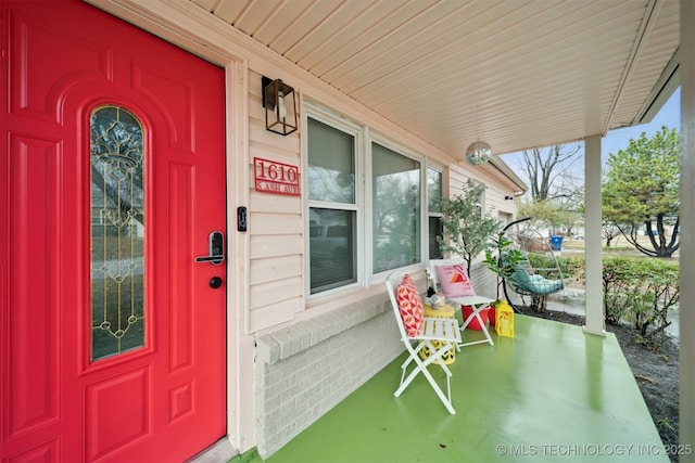 1610 S Ash Ave, Broken Arrow, OK 74012 - doorway to property with a porch