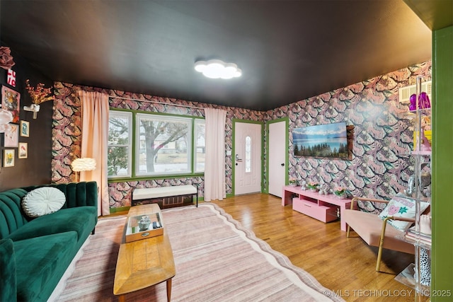 1610 S Ash Ave, Broken Arrow, OK 74012 - living room featuring wallpapered walls and wood finished floors