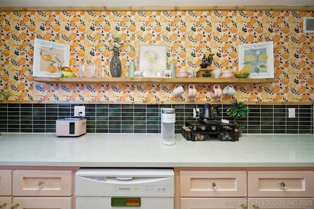 1610 S Ash Ave, Broken Arrow, OK 74012 - detailed view of white dishwasher, backsplash, and light countertops