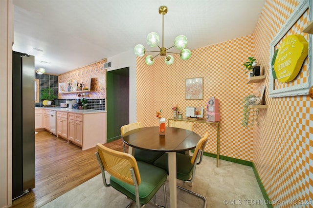 1610 S Ash Ave, Broken Arrow, OK 74012 - dining room with a chandelier, wallpapered walls, and baseboards