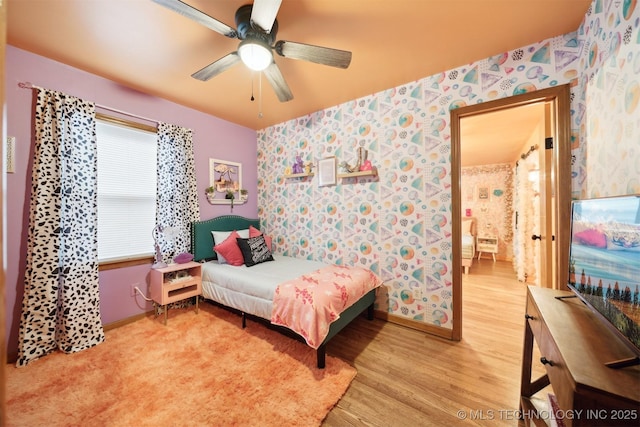 1610 S Ash Ave, Broken Arrow, OK 74012 - bedroom with wallpapered walls, light wood-style floors, baseboards, and ceiling fan