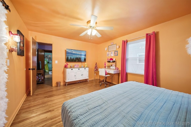 1610 S Ash Ave, Broken Arrow, OK 74012 - bedroom featuring wood finished floors, baseboards, and a ceiling fan