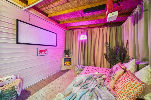 1610 S Ash Ave, Broken Arrow, OK 74012 - bedroom with wooden walls, wood finished floors, and wooden ceiling with exposed beams