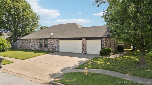 10901 E 95th St N, Owasso, OK 74055 - view of front of house featuring a garage, driveway, brick siding, and a shingled roof