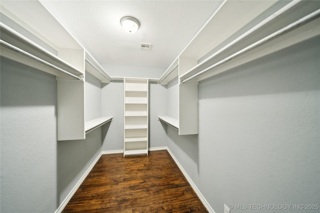 10901 E 95th St N, Owasso, OK 74055 - walk in closet featuring wood finished floors