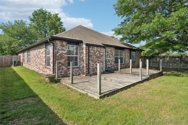 10901 E 95th St N, Owasso, OK 74055 - rear view of property featuring a deck, brick siding, and roof with shingles