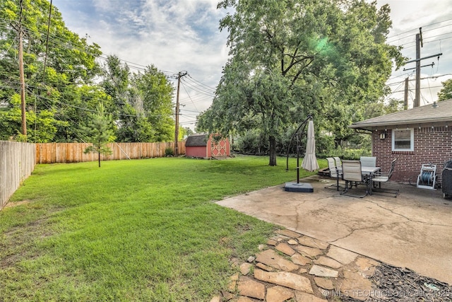 4023 E 36th St S, Tulsa, OK 74135 - fenced backyard featuring a patio area, a storage unit, and outdoor dining space