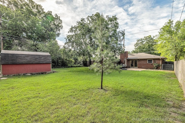 4023 E 36th St S, Tulsa, OK 74135 - view of yard with a storage unit, a patio area, and french doors