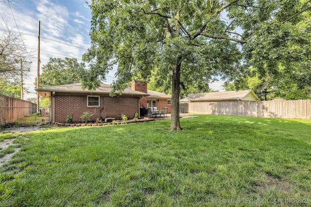 4023 E 36th St S, Tulsa, OK 74135 - fenced backyard with a patio