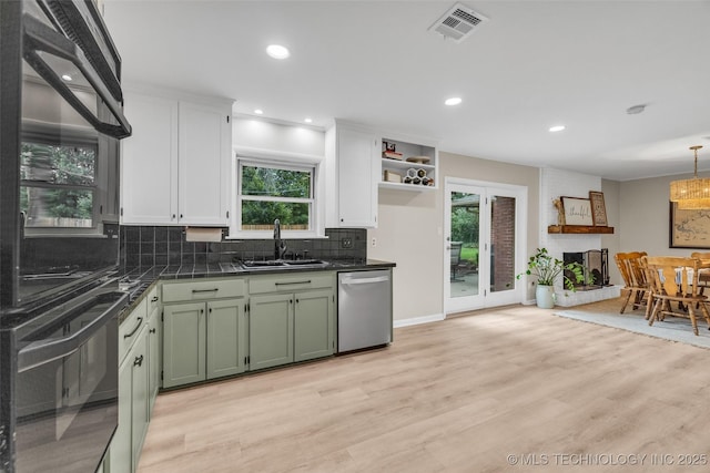 4023 E 36th St S, Tulsa, OK 74135 - kitchen featuring dishwasher, dark countertops, green cabinets, tasteful backsplash, and healthy amount of natural light