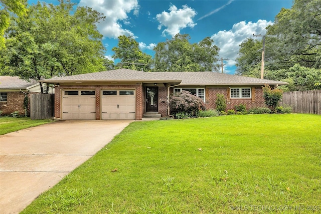 4023 E 36th St S, Tulsa, OK 74135 - view of front of house featuring an attached garage, driveway, brick siding, and roof with shingles