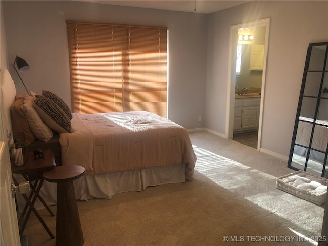 18820 Ridge Rd, Catoosa, OK 74015 - bedroom with carpet flooring, a sink, baseboards, and connected bathroom