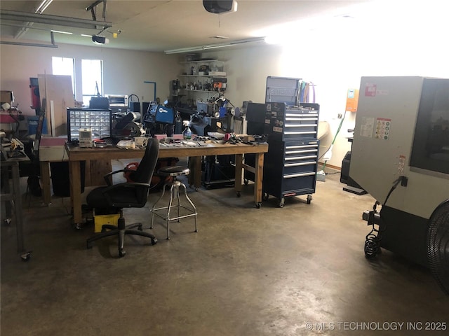 18820 Ridge Rd, Catoosa, OK 74015 - garage featuring a workshop area and a garage door opener