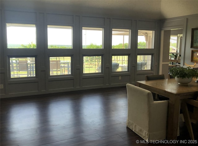 18820 Ridge Rd, Catoosa, OK 74015 - dining space with a decorative wall and dark wood-type flooring
