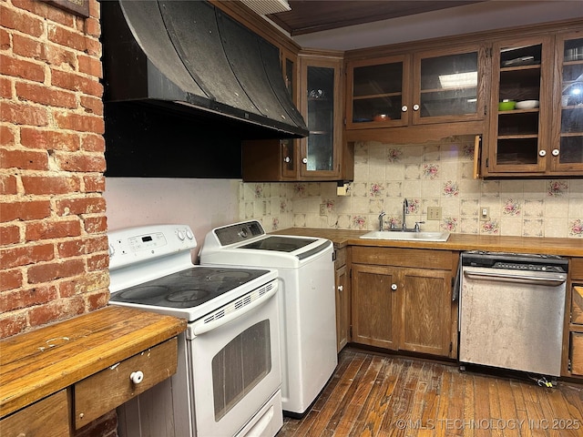 502 S Okmulgee Ave, Okmulgee, OK 74447 - kitchen featuring dishwasher, white electric range, washing machine and dryer, exhaust hood, and dark wood finished floors