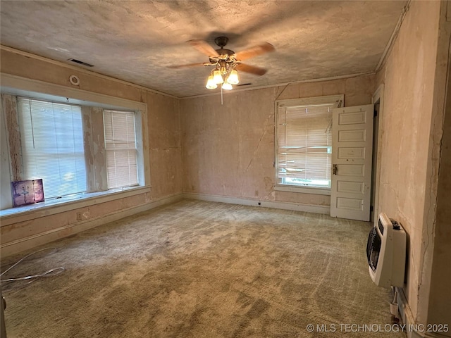 502 S Okmulgee Ave, Okmulgee, OK 74447 - carpeted spare room with heating unit and ceiling fan
