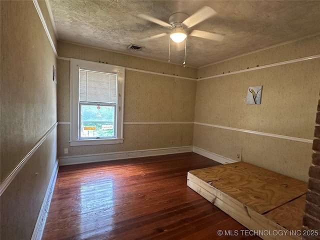 502 S Okmulgee Ave, Okmulgee, OK 74447 - spare room featuring wood-type flooring and a ceiling fan