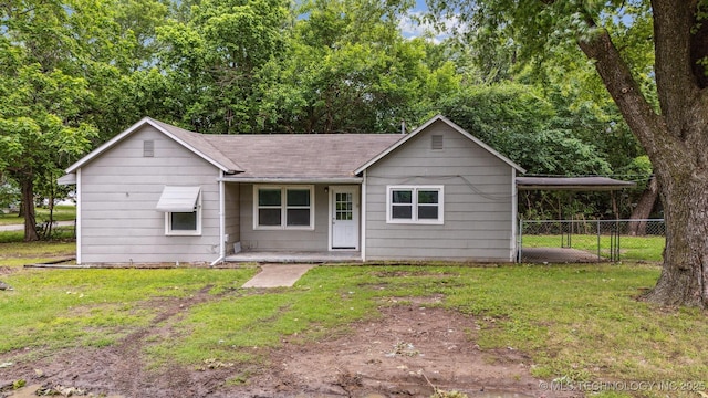 1123 Spring St, Collinsville, OK 74021 - single story home with a shingled roof, covered porch, and a carport