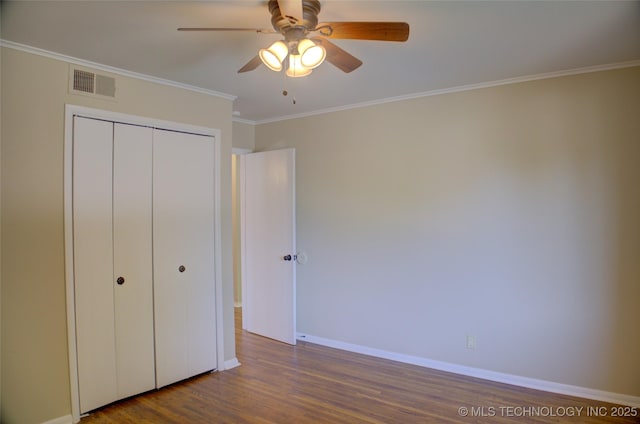 5764 E 30th Pl, Tulsa, OK 74114 - unfurnished bedroom with dark wood finished floors, crown molding, a closet, baseboards, and ceiling fan