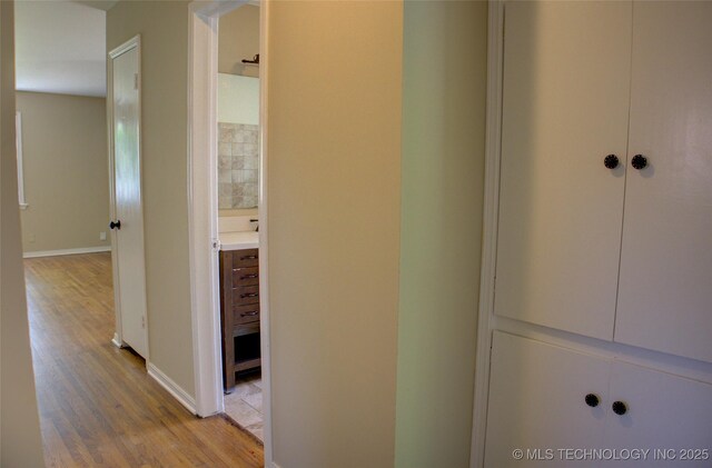 5764 E 30th Pl, Tulsa, OK 74114 - hall with light wood-type flooring and baseboards