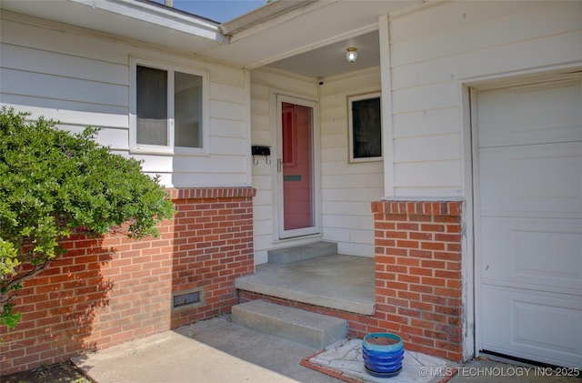 5764 E 30th Pl, Tulsa, OK 74114 - view of exterior entry with brick siding and crawl space