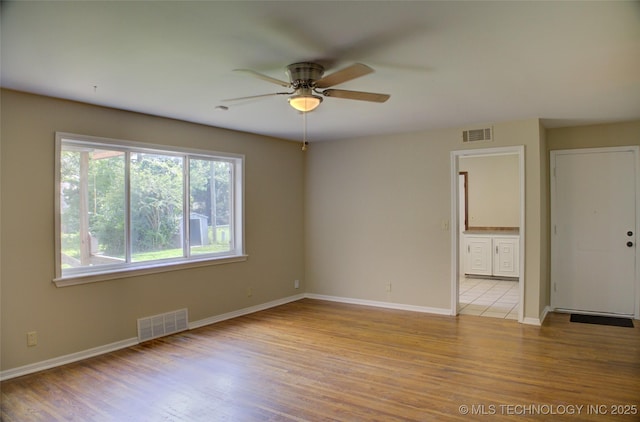 5764 E 30th Pl, Tulsa, OK 74114 - spare room with a ceiling fan and wood finished floors