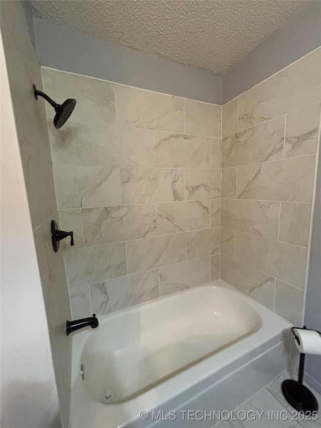 1310 S 38th St, Muskogee, OK 74401 - bathroom with a textured ceiling and bathing tub / shower combination