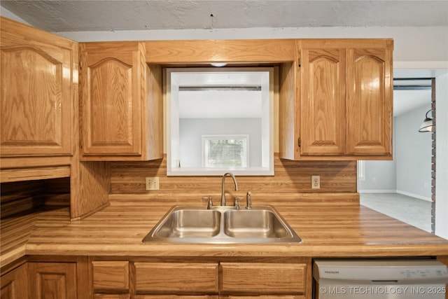 1703 Elm St, Owasso, OK 74055 - kitchen featuring a sink, dishwasher, and butcher block countertops