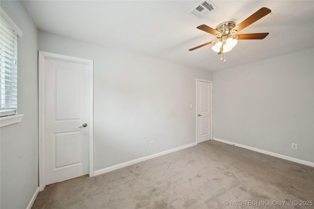1703 Elm St, Owasso, OK 74055 - empty room featuring ceiling fan, carpet flooring, and baseboards