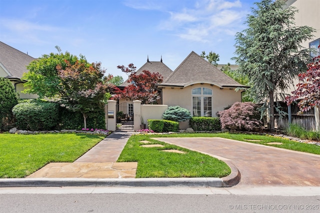 1336 E 35th Pl, Tulsa, OK 74105 - view of front of home with stucco siding, a gate, and roof with shingles