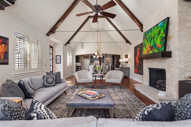 1336 E 35th Pl, Tulsa, OK 74105 - living room with ceiling fan, wood finished floors, beamed ceiling, baseboards, and a chandelier