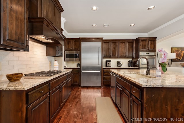 1336 E 35th Pl, Tulsa, OK 74105 - kitchen with built in appliances, a sink, dark wood finished floors, crown molding, and dark brown cabinets