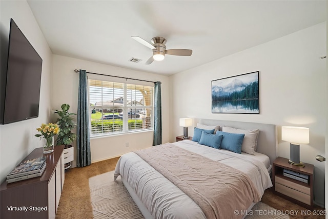 carpeted bedroom with baseboards and ceiling fan