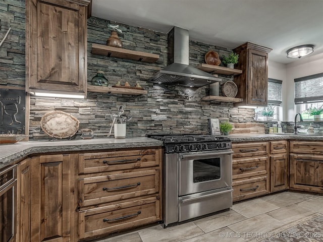 32188 E 738th Rd, Wagoner, OK 74467 - kitchen featuring stainless steel range with gas stovetop, open shelves, a sink, and decorative backsplash