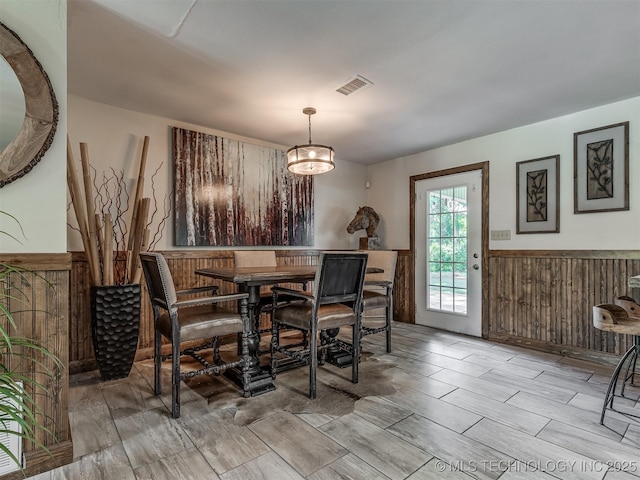 32188 E 738th Rd, Wagoner, OK 74467 - dining room featuring wainscoting, wood walls, and wood tiled floors