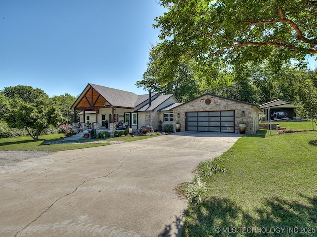 32188 E 738th Rd, Wagoner, OK 74467 - view of front of property with a porch, driveway, stone siding, and a garage