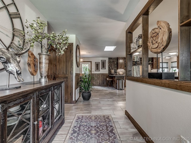 32188 E 738th Rd, Wagoner, OK 74467 - corridor with healthy amount of natural light, a wainscoted wall, and a skylight