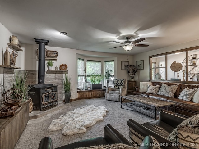 32188 E 738th Rd, Wagoner, OK 74467 - carpeted living room with a wood stove and ceiling fan