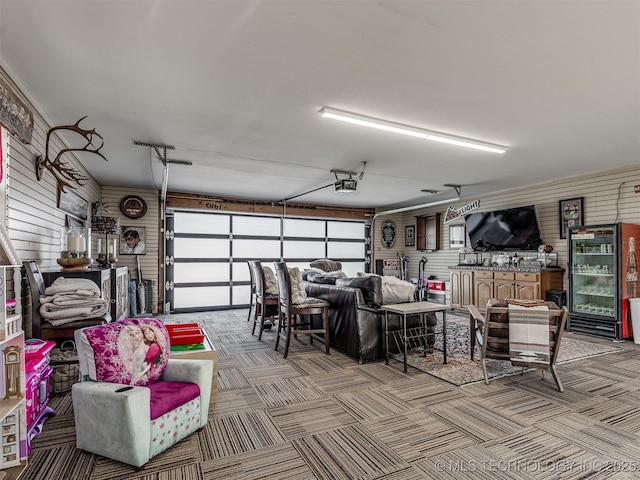 32188 E 738th Rd, Wagoner, OK 74467 - garage featuring a garage door opener and wood walls