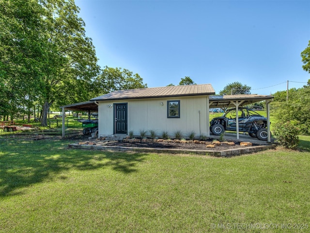 32188 E 738th Rd, Wagoner, OK 74467 - view of side of property featuring a carport, a yard, and metal roof