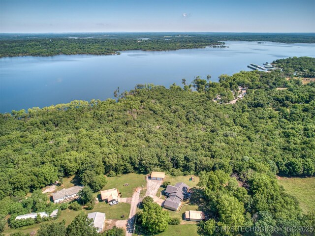 32188 E 738th Rd, Wagoner, OK 74467 - drone / aerial view of a heavily wooded area and a nearby body of water