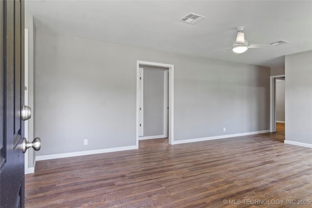 245 E 148th St S, Glenpool, OK 74033 - unfurnished room with ceiling fan, dark wood-type flooring, and baseboards