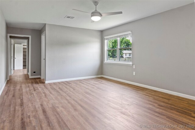 245 E 148th St S, Glenpool, OK 74033 - empty room with baseboards, a ceiling fan, and wood finished floors