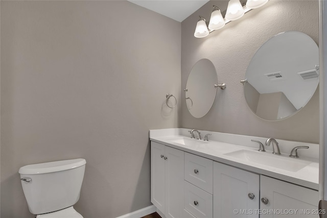 245 E 148th St S, Glenpool, OK 74033 - bathroom featuring toilet and double vanity