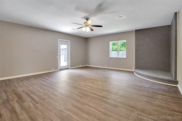 245 E 148th St S, Glenpool, OK 74033 - spare room with a ceiling fan, wood finished floors, and baseboards