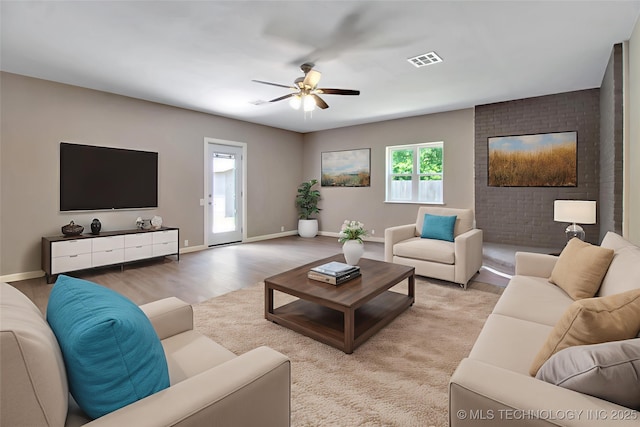 245 E 148th St S, Glenpool, OK 74033 - living area featuring light wood-type flooring, a ceiling fan, and baseboards