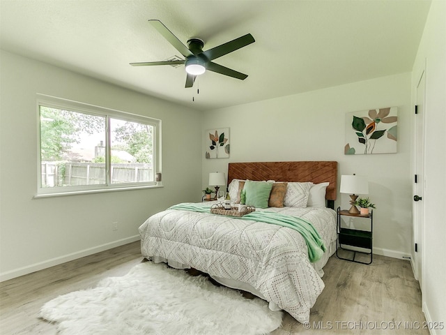 316 E Austin St, Broken Arrow, OK 74011 - bedroom featuring wood finished floors, baseboards, and ceiling fan