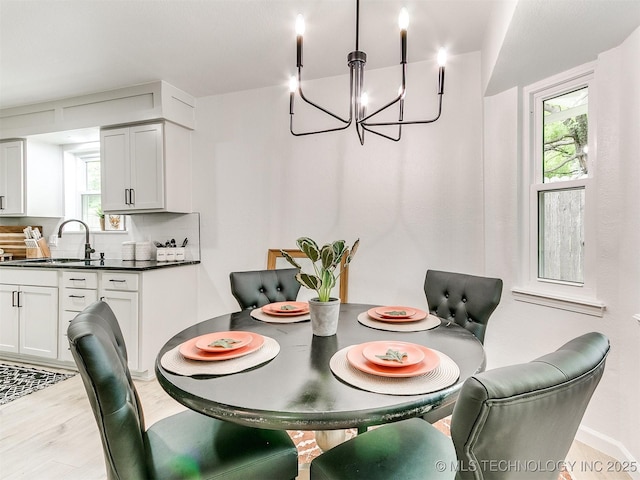 316 E Austin St, Broken Arrow, OK 74011 - dining room featuring a chandelier and light wood finished floors